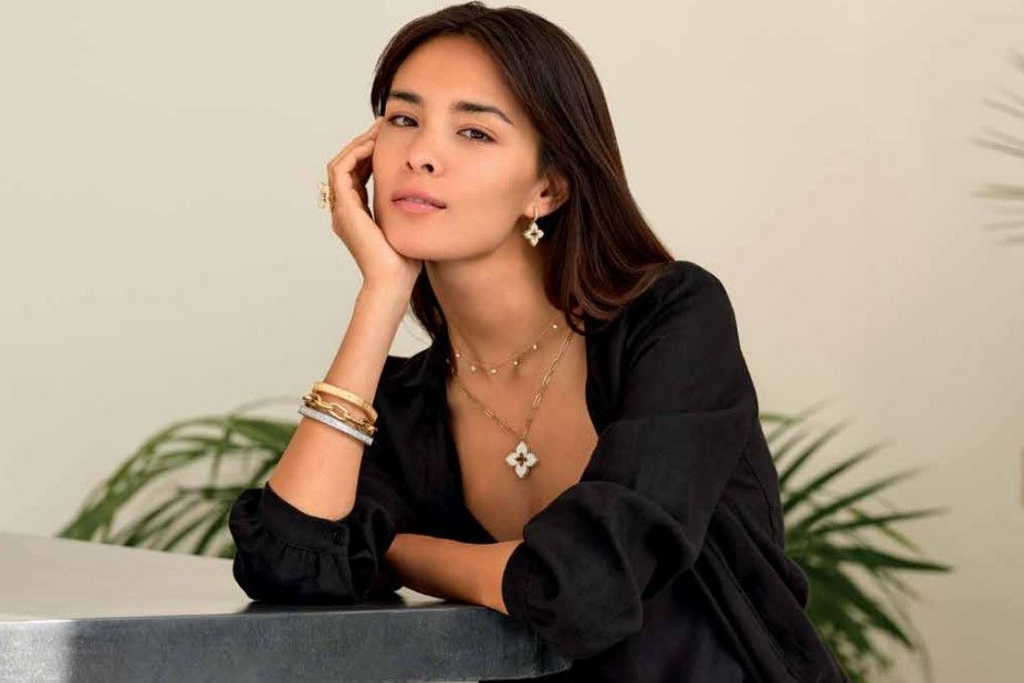 a beautiful woman in black wearing Roberto Coin jewelry