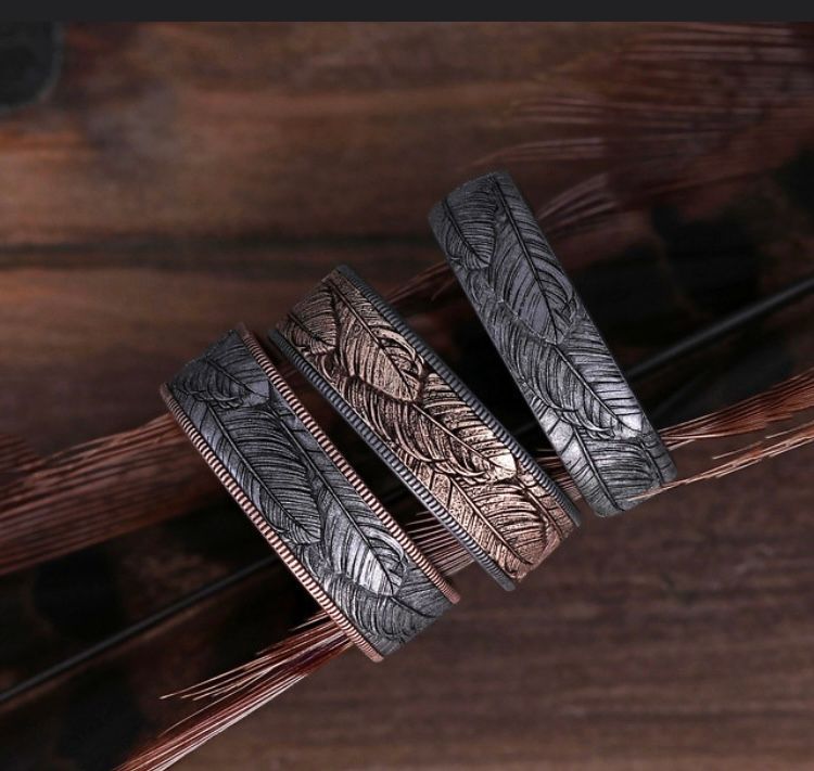three wedding band with engraved design