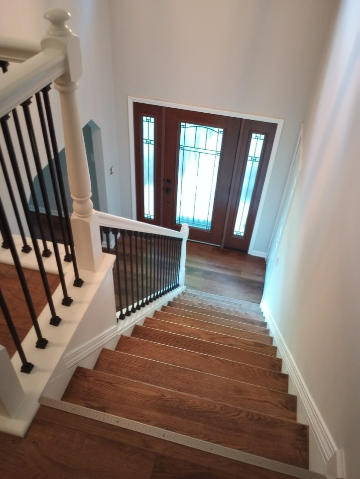 A staircase leading up to a door in a house