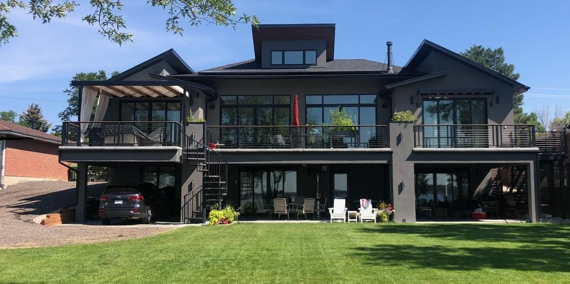 Two-story house with a wooden deck remodel - after