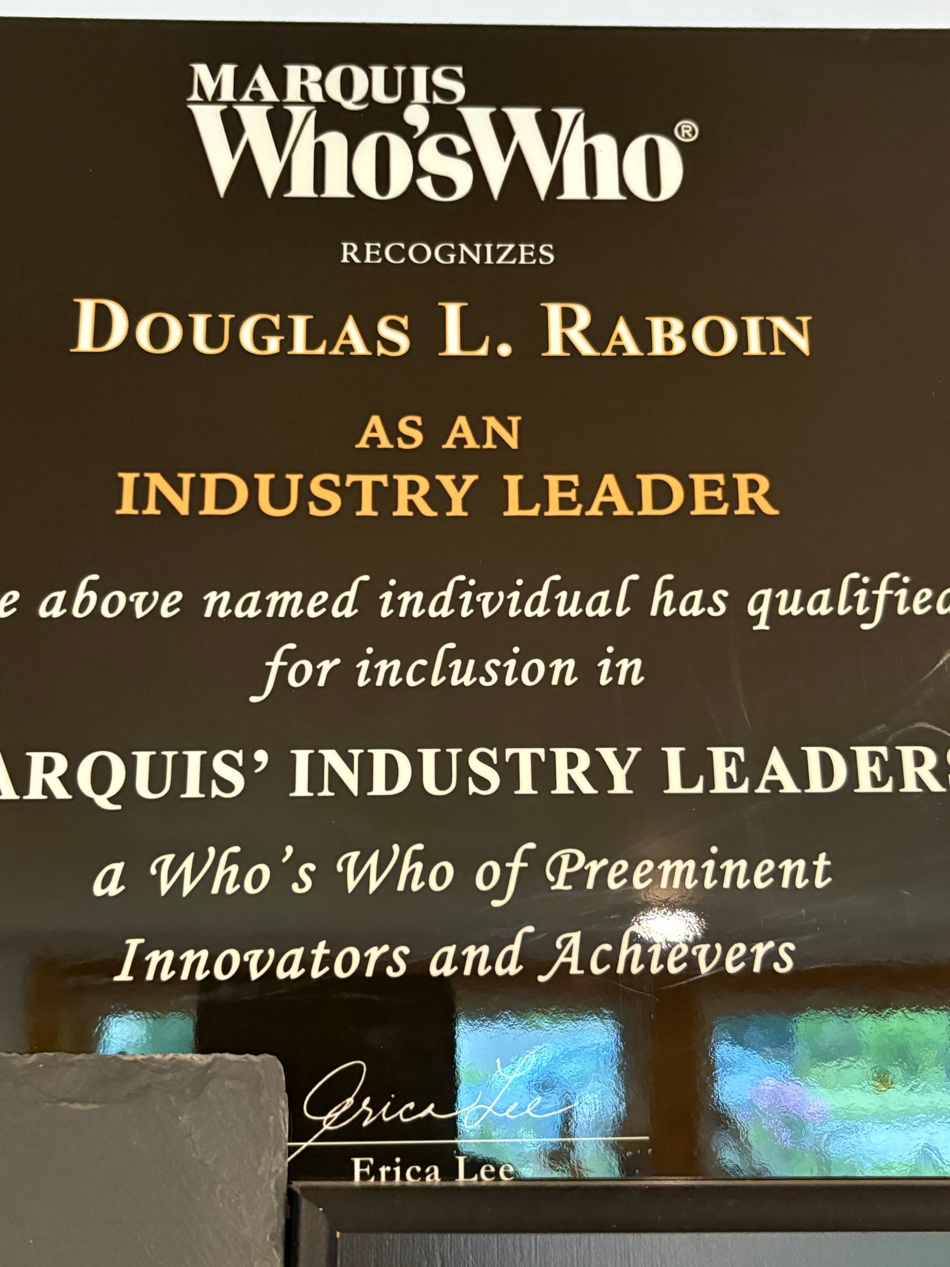 Marquis Who's Who recognition plaque for Douglas L. Raboin as an industry leader and innovator