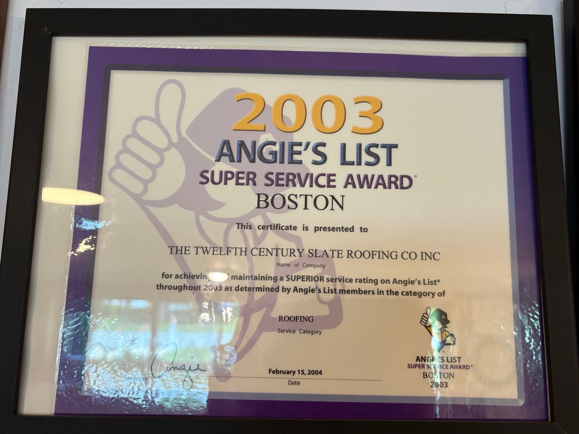 Framed 2003 Angie’s List Super Service Award certificate with purple border and gold lettering