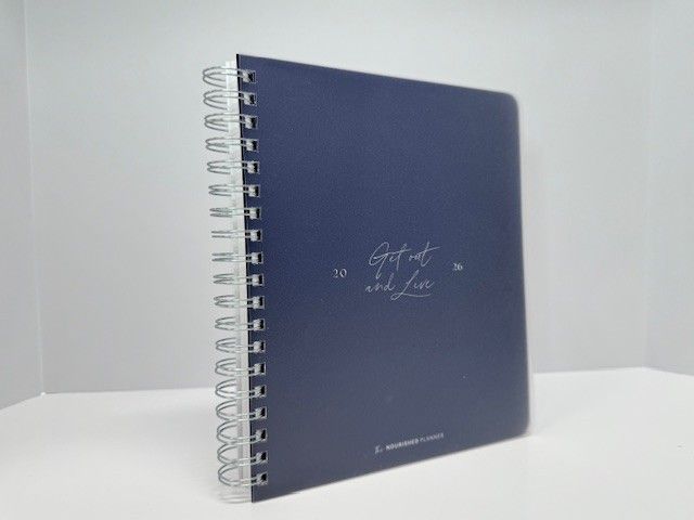 Navy blue spiral-bound notebook with 