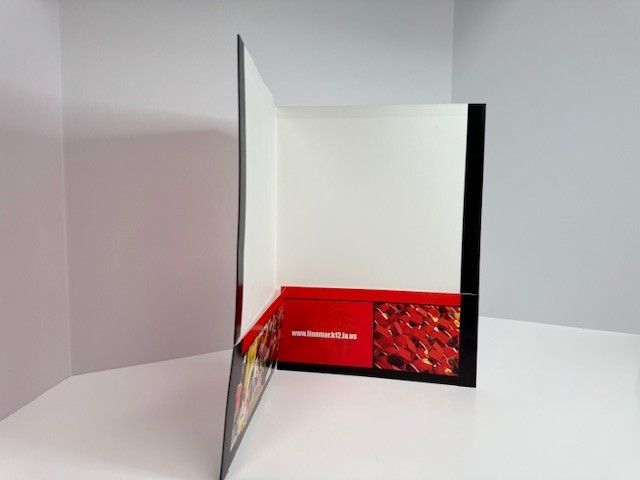 Open presentation folder with red and black design.