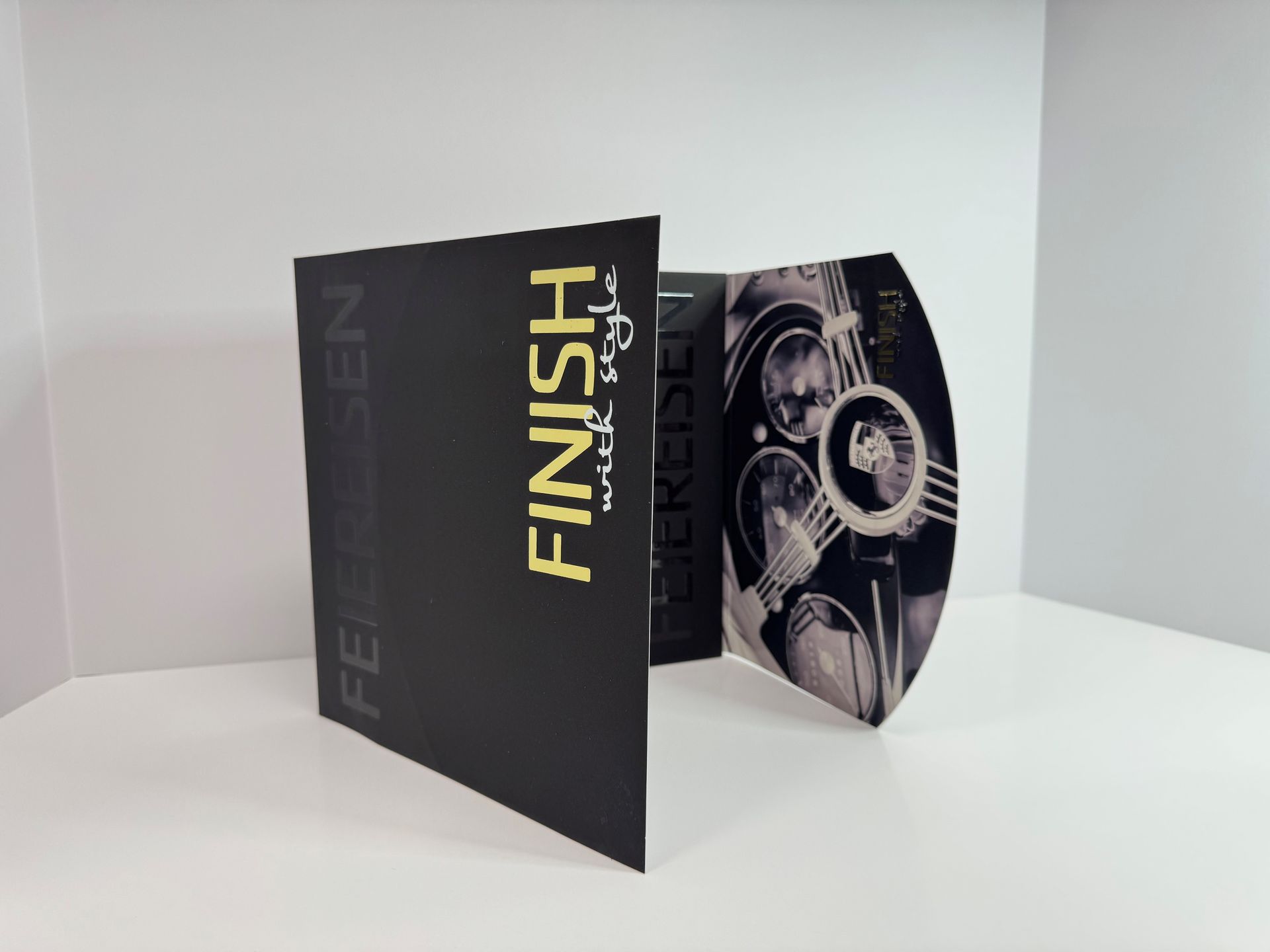 Black brochure with gold text 