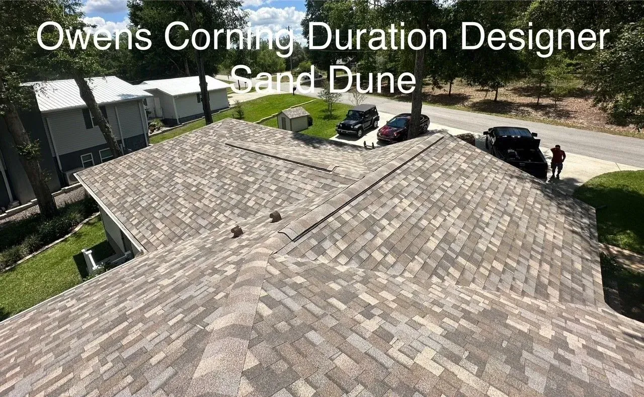 Roof with Owens Corning Duration Designer shingles in Sand Dune color, viewed from above.