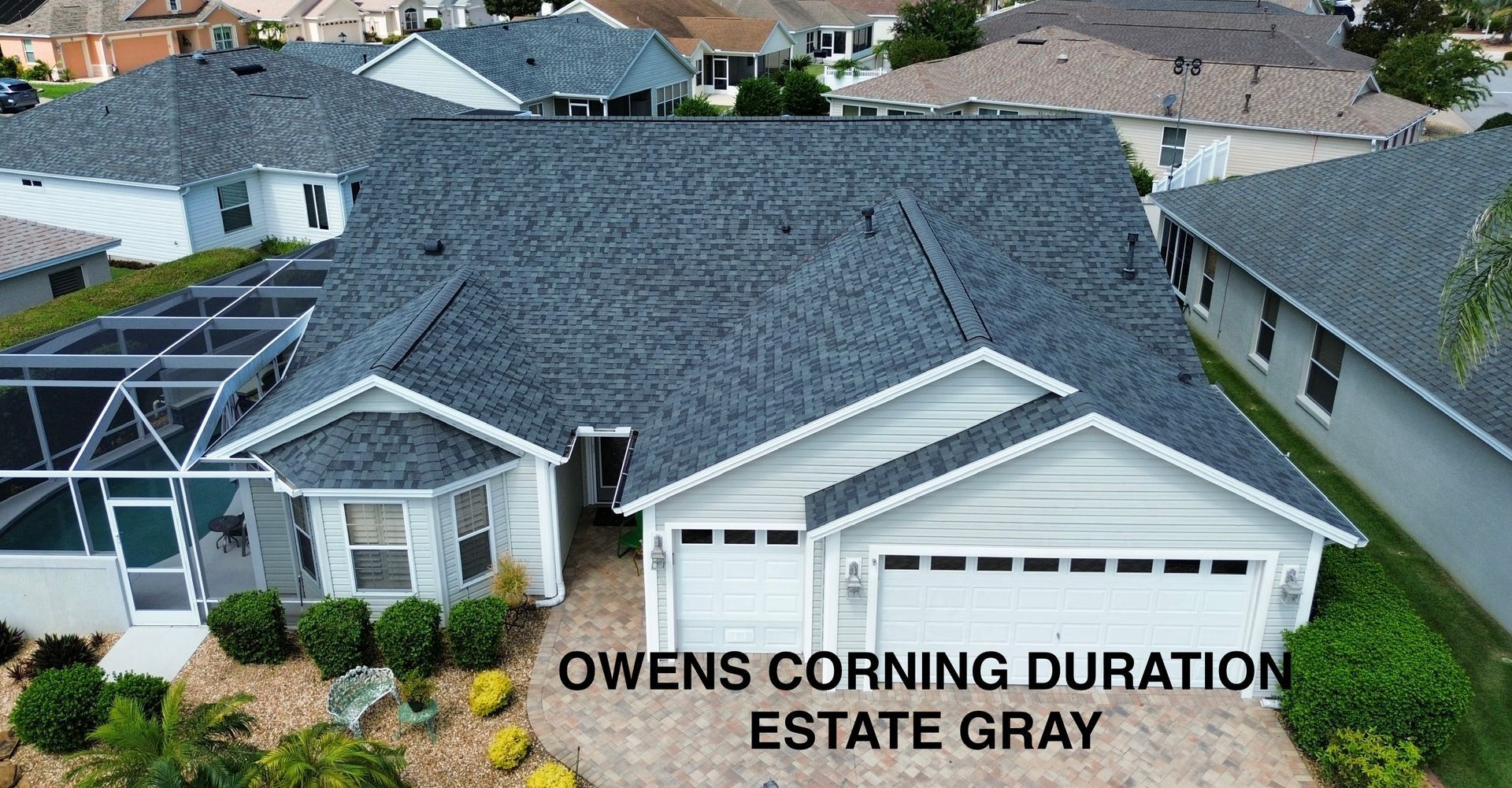 Aerial view of a house with dark gray Owens Corning Duration Estate shingles.