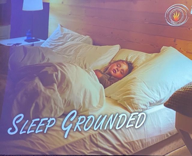 Close-up of a tightly curled, vibrant green leaf, with prominent veins and a smooth texture.