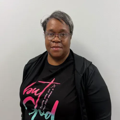 Woman wearing glasses, black shirt with 