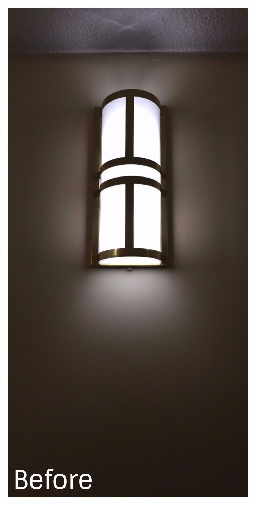 A picture of a wall light before it was changed.