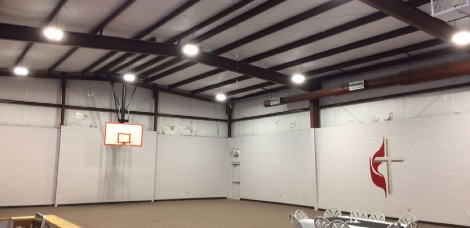 There is a basketball hoop in the middle of the room.