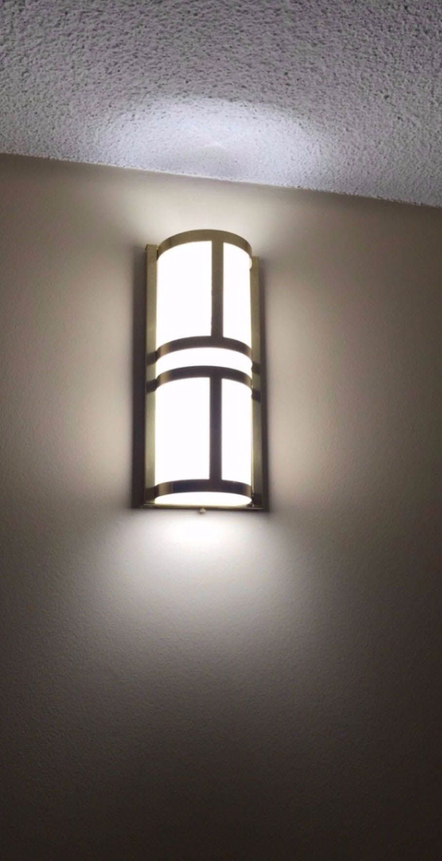 There is a light on the wall that looks like a window.