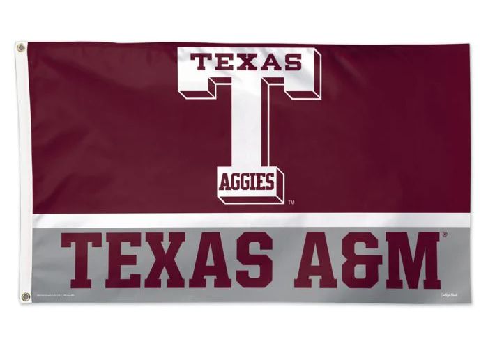 A maroon and grey Texas A&M flag featuring a large white block 'T' logo with 'Aggies' and 'Texas A&M' written in text.