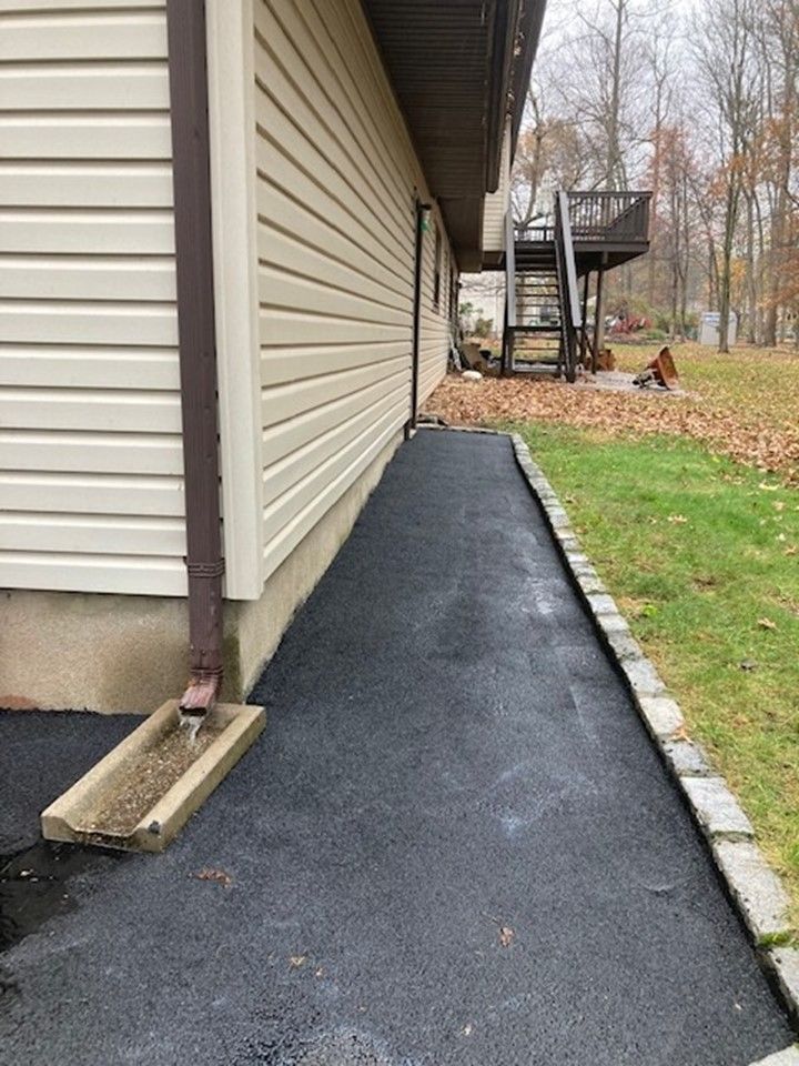 newly paved walkway from the back of the house