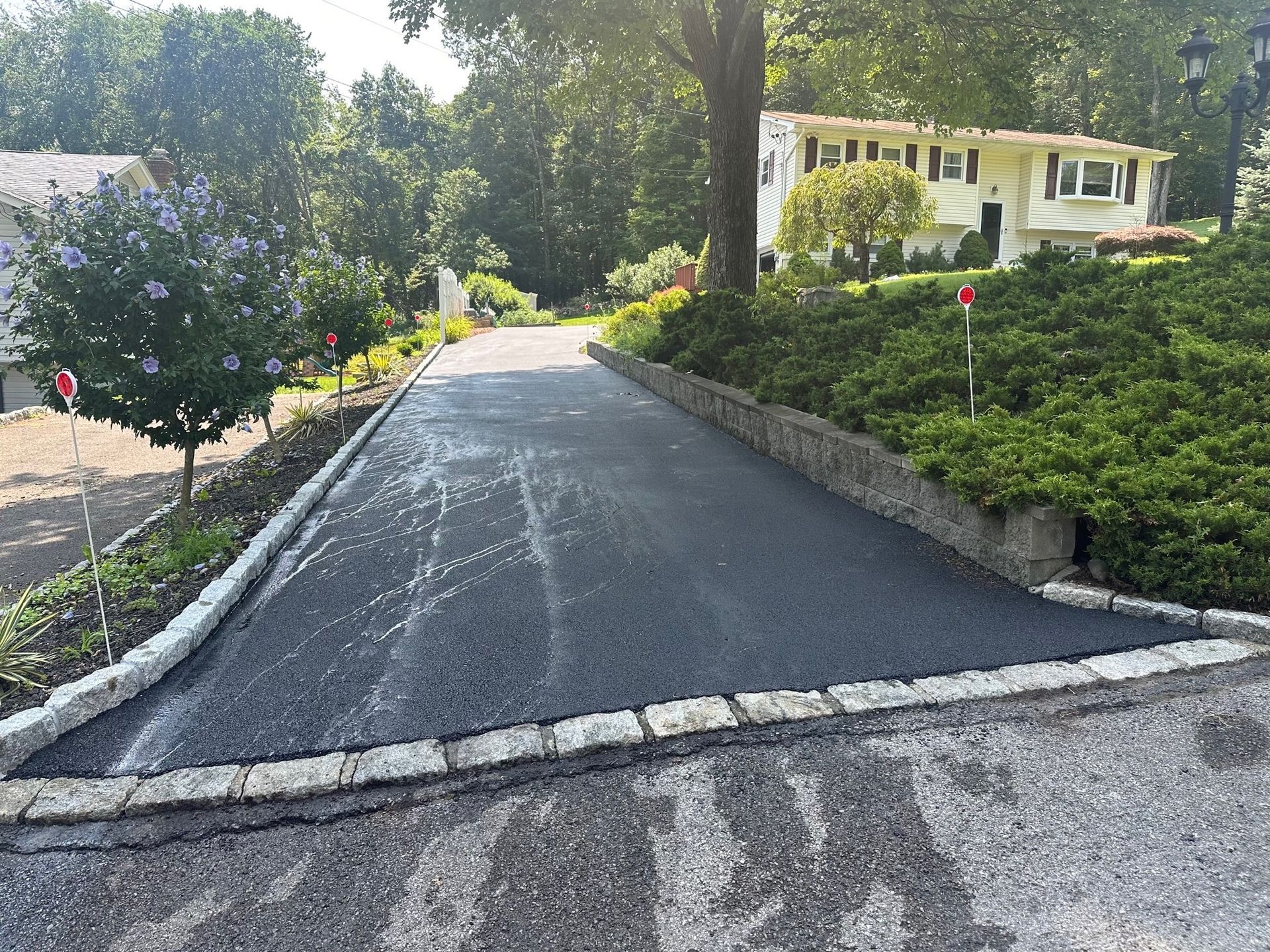 asphalt driveway with reflective markers
