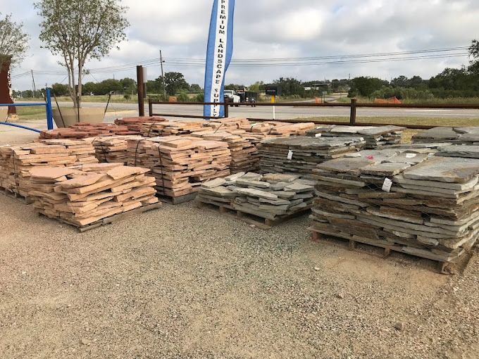 A bunch of pallets of rocks are stacked on top of each other