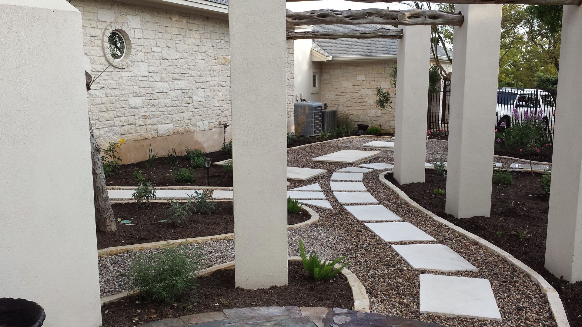 A walkway between two buildings with a clock on the wall
