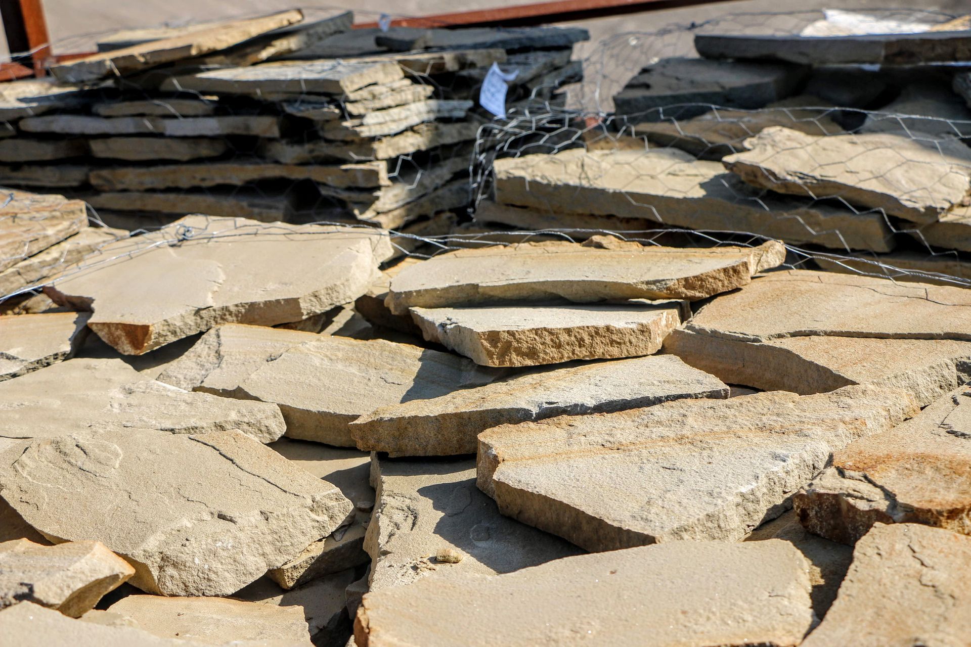 A pile of rocks sitting on top of each other on the ground.