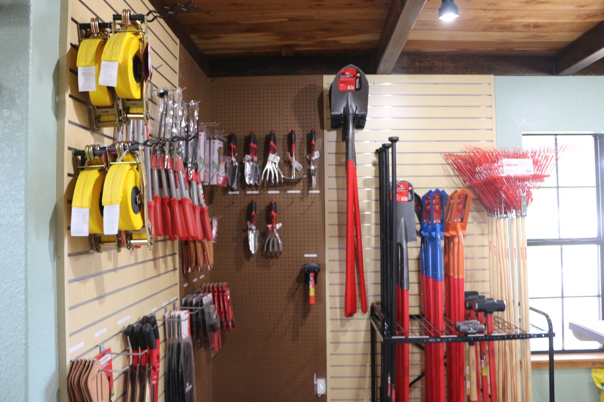 A bunch of tools are hanging on a wall in a store