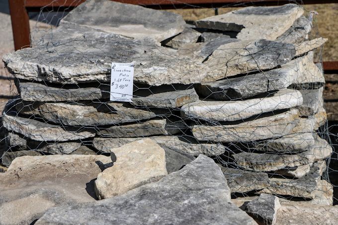 A pile of rocks sitting on top of each other on a fence.