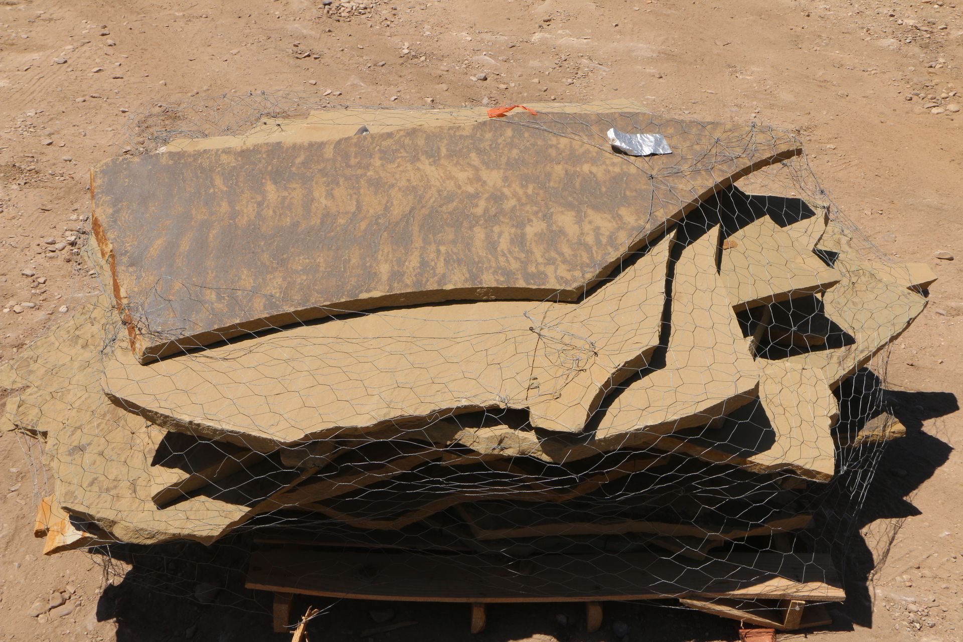 A large piece of wood is laying on the ground