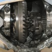 A close up of a gearbox with a broken gear.