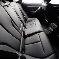 A close up of the back seat of a car.