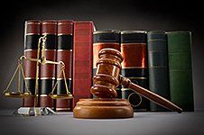 Gavel, legal books and justice scale