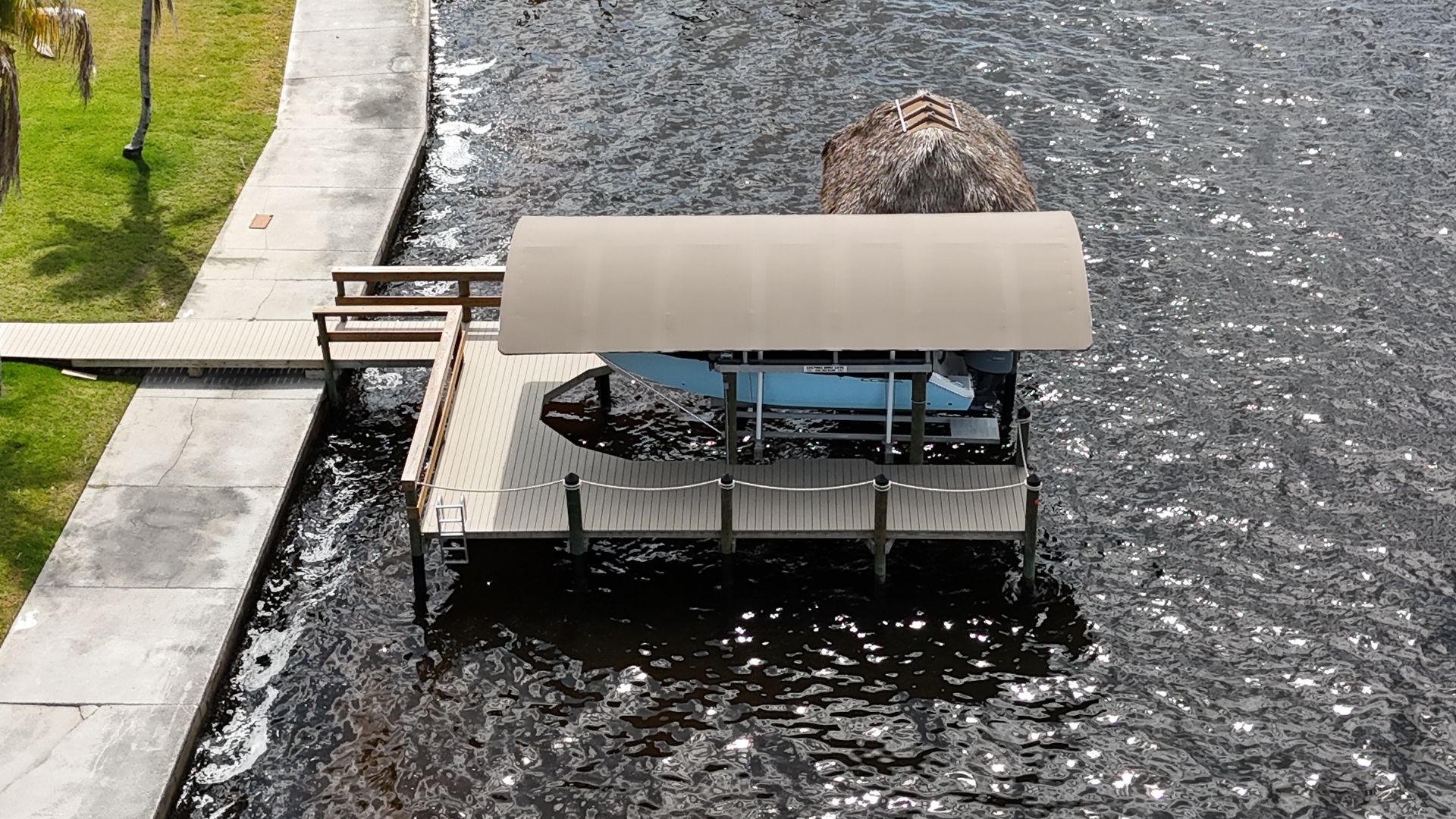 An aerial view of a dock with a boat on it
