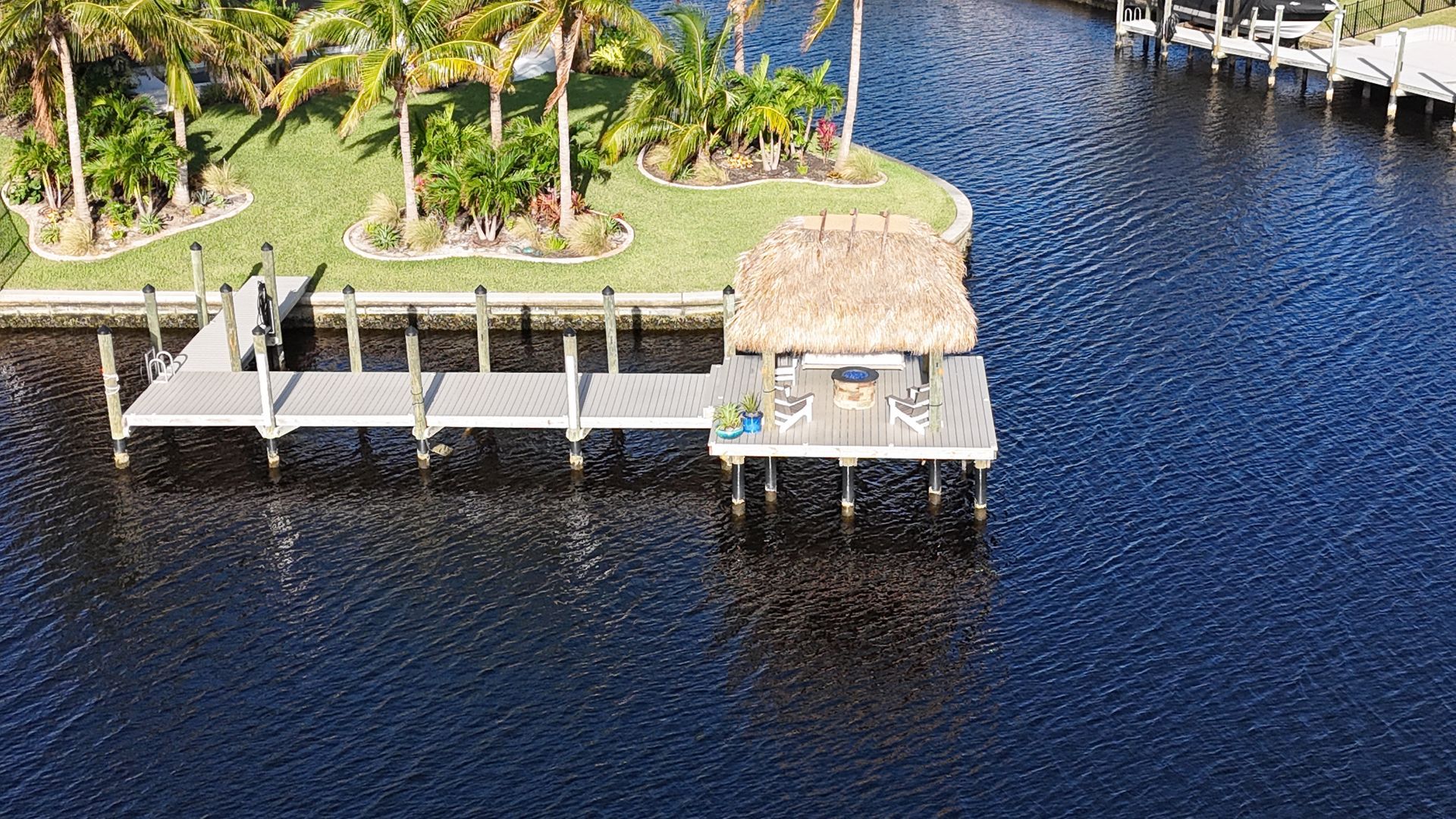 An aerial view of a dock in the middle of a body of water.