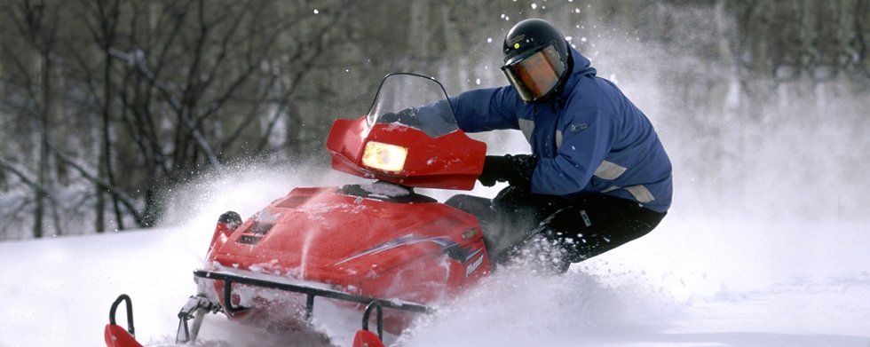 Man riding a snow mobile