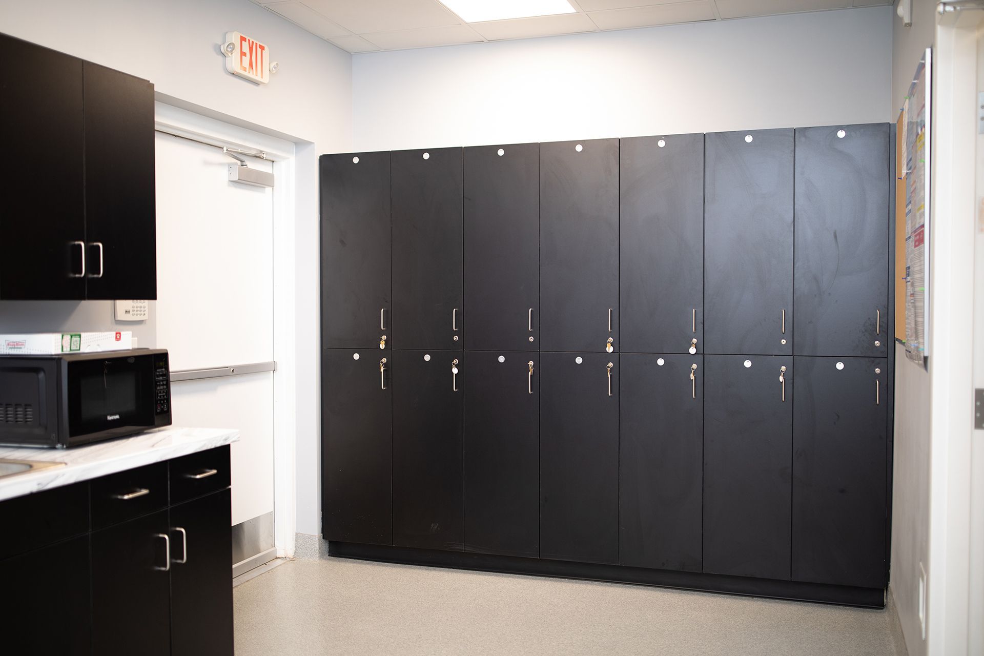 Bowling Green Veterinary Emergency Clinic kitchen with black cabinets and a microwave.