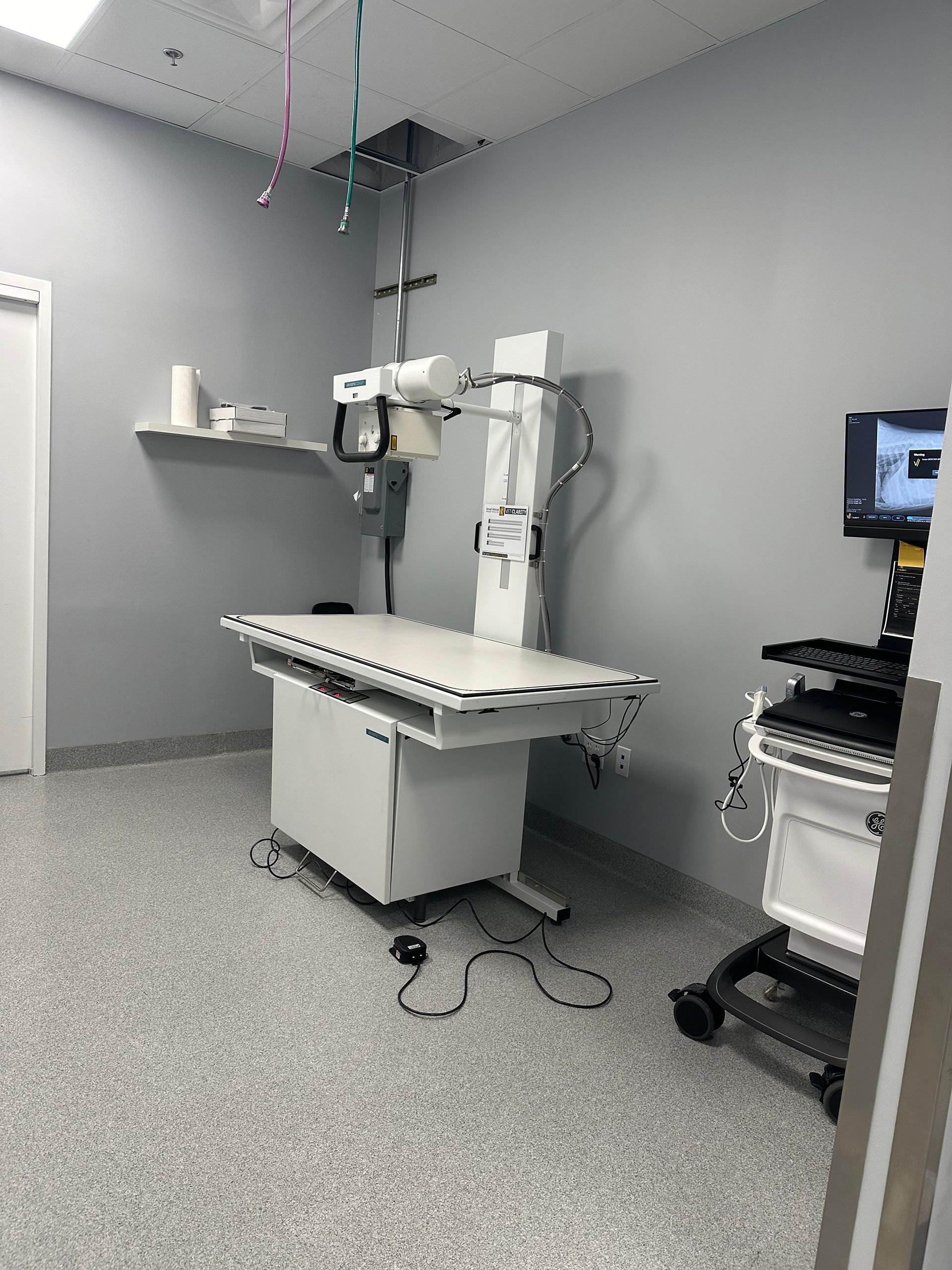 An X-ray machine is placed on top of a table in a room at Bowling Green Veterinary Emergency Clinic.