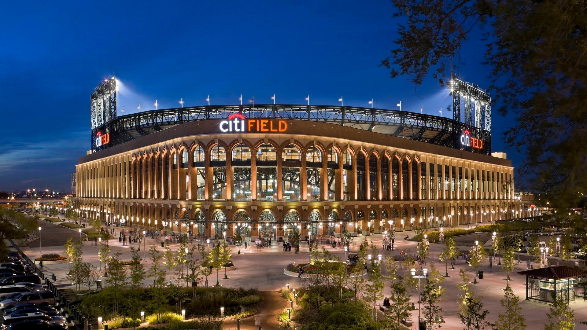 A large stadium is lit up at night.
