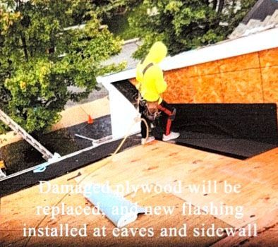 Roof worker in yellow shirt replacing damaged wood and flashing on a shingled roof