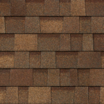 A repeating pattern of rectangular brown asphalt roofing shingles with varied color shading.