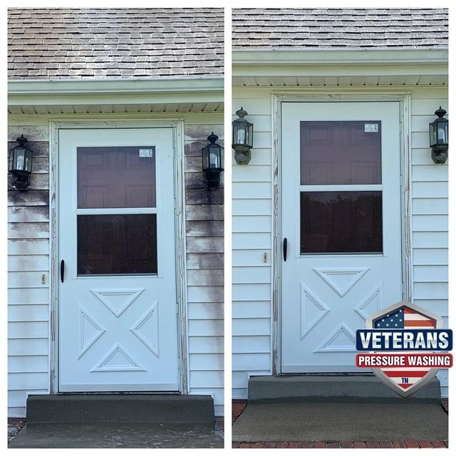 Before and after power washing: White door and siding cleaned; dark stains removed.