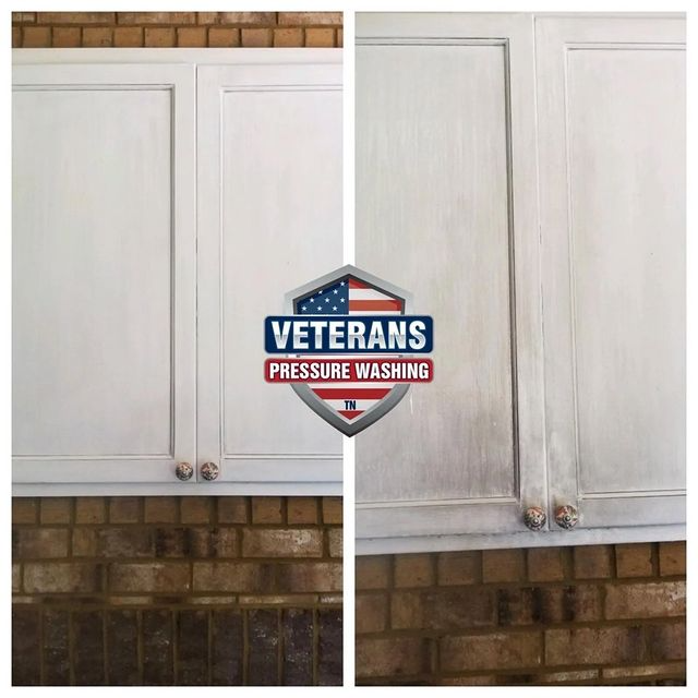White kitchen cabinets before and after pressure washing, with brick wall below.