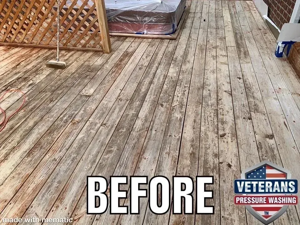 Deck with worn, weathered wood boards; 
