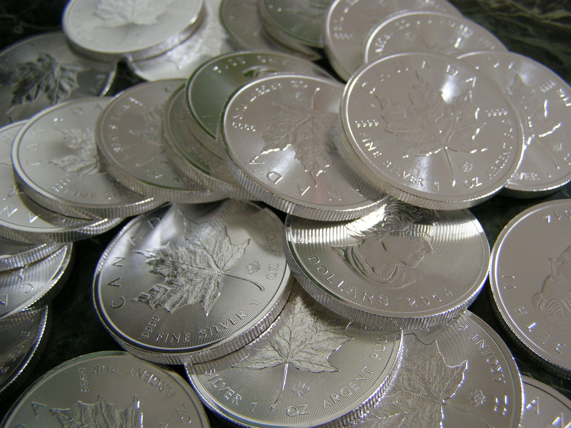 A pile of silver coins stacked on top of each other