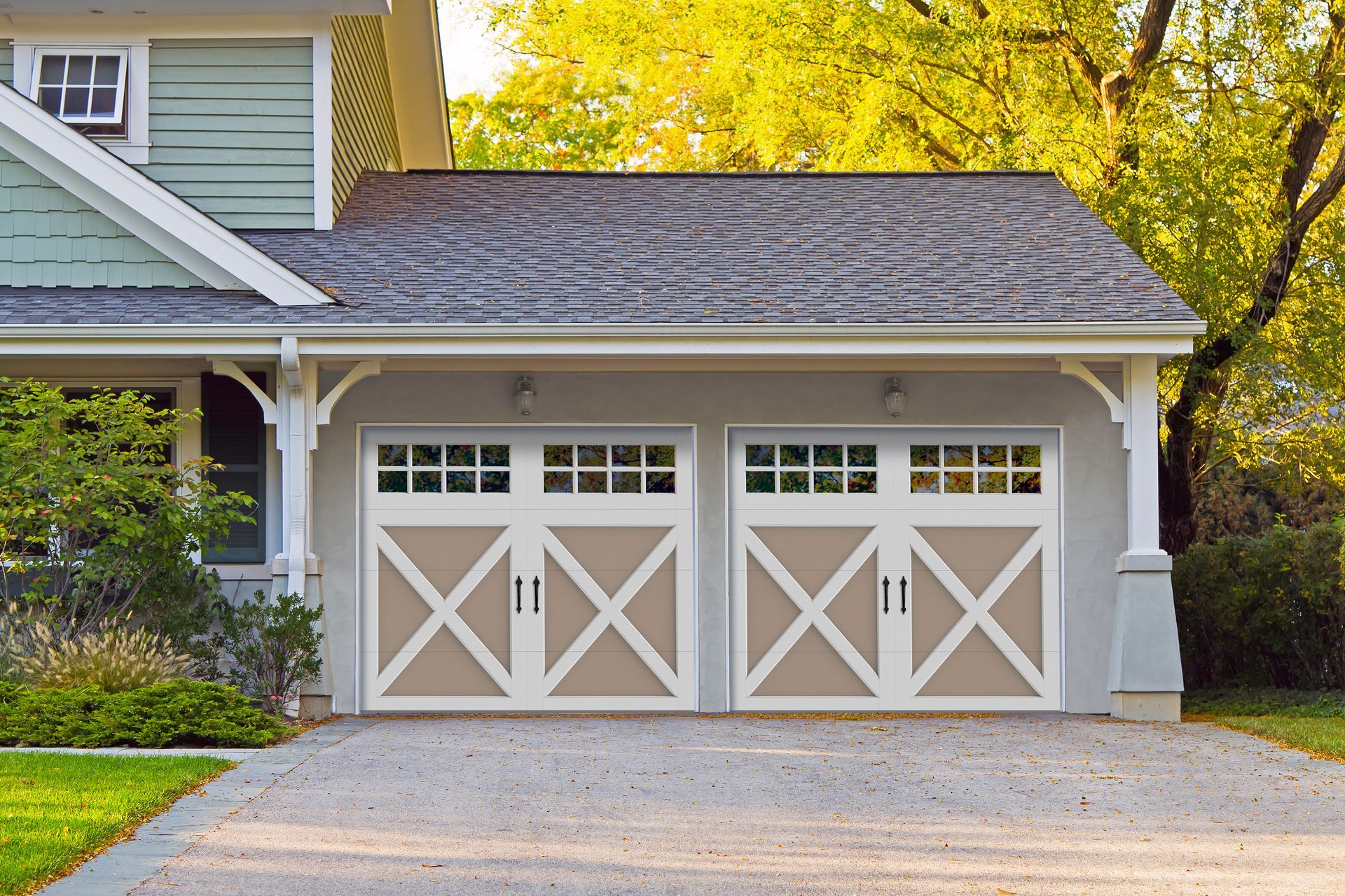 green siding with white garage door