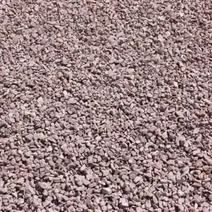 Close-up of a pile of small, reddish-gray gravel stones.