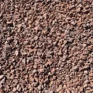 Crushed red gravel, scattered across a surface.