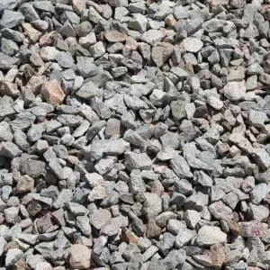 Crushed gravel of varying sizes and colors, mostly gray with some tan and pink.