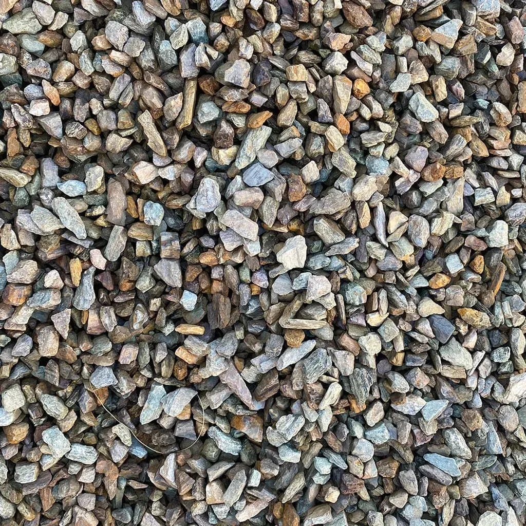 Pile of small, earthy-toned gravel rocks for landscaping and drainage.