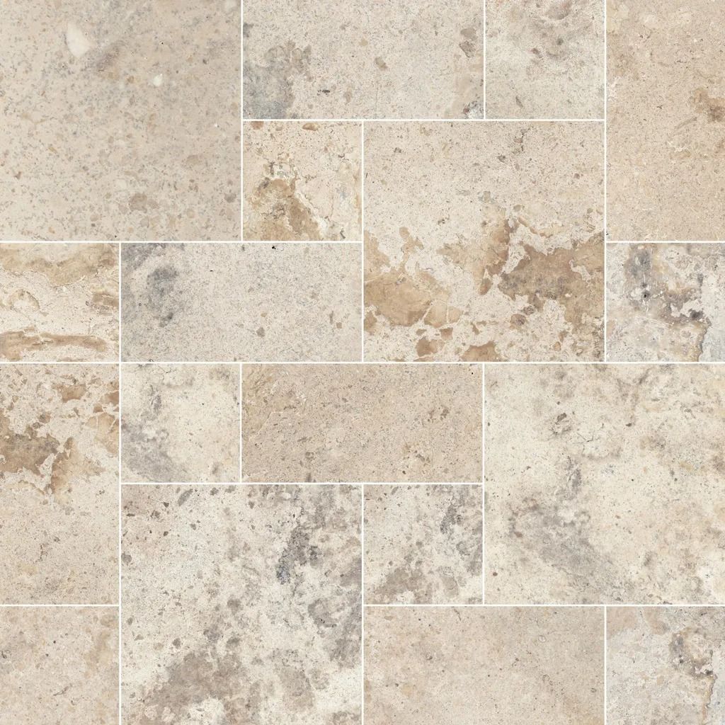 Beige and tan stone tile floor in a pattern of various sized rectangles.