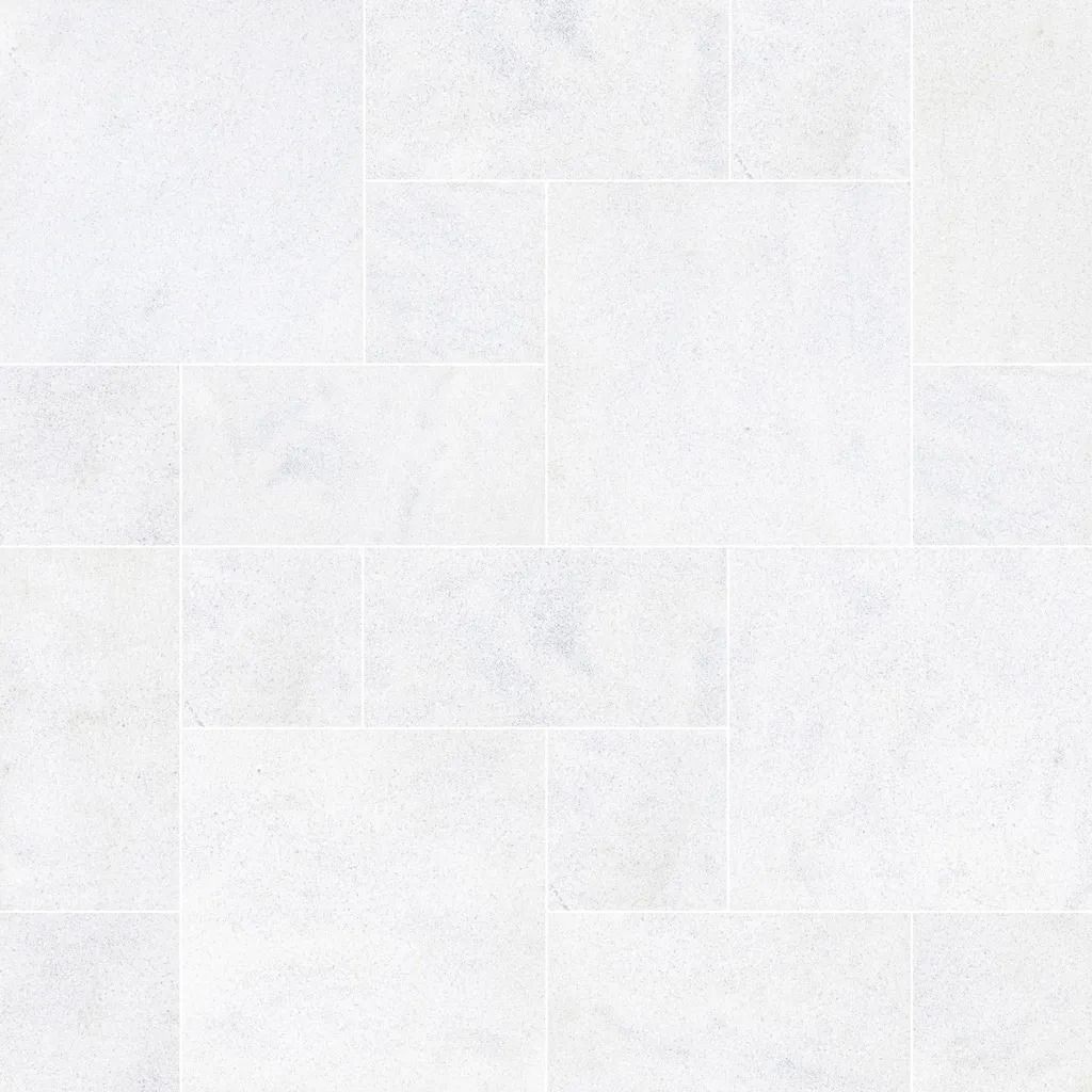 White stone tile floor with a speckled texture and rectangular pattern.