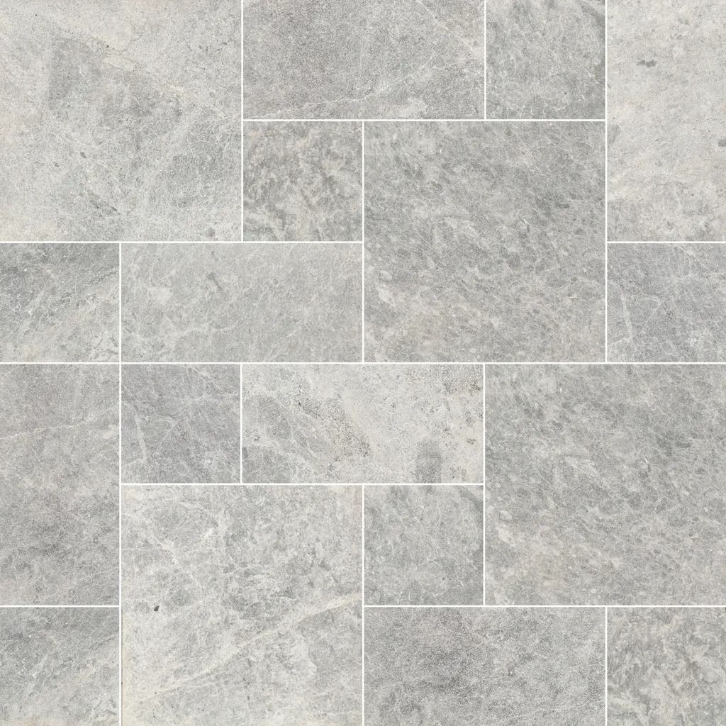 Gray rectangular stone tiles arranged in a pattern with white grout lines.