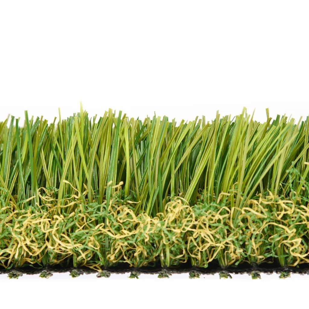 Close-up of artificial turf showing green and yellow blades, and a black base with small protrusions.