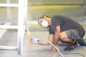 Learn More About Our Powder Coating Services Worker